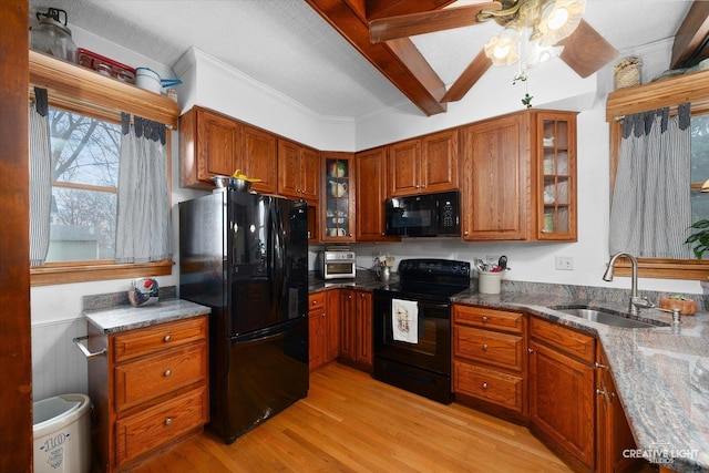 416 Stilson St, Earlville, IL 60518 - kitchen with a sink, light wood-type flooring, black appliances, and brown cabinets
