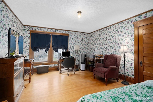 416 Stilson St, Earlville, IL 60518 - bedroom with a textured ceiling, ornamental molding, wood finished floors, wallpapered walls, and baseboards