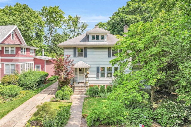 traditional style home with a chimney