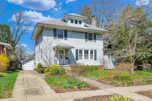 american foursquare style home featuring a detached garage, fence, and a chimney