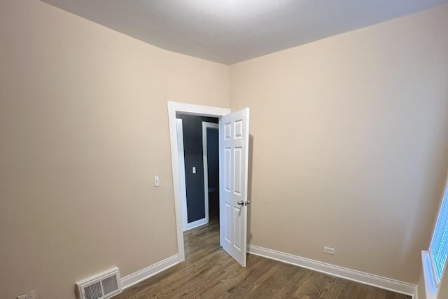 325 W 107th St, Chicago, IL 60628 - empty room with dark wood-style flooring and baseboards