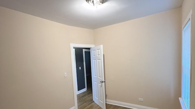 325 W 107th St, Chicago, IL 60628 - spare room featuring wood finished floors and baseboards