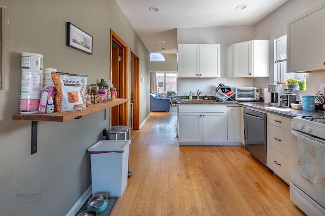 530 N Ashland Ave, Chicago, IL 60622 - kitchen with dishwasher, a sink, white range with gas cooktop, white cabinetry, and light wood-style flooring