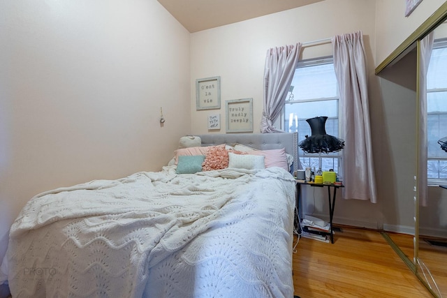 530 N Ashland Ave, Chicago, IL 60622 - bedroom with baseboards and wood finished floors