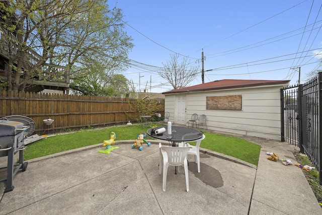view of patio with a fenced backyard and an outdoor structure