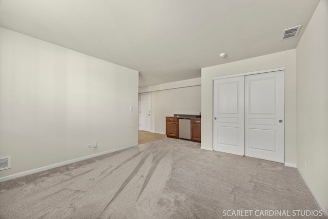 1045 Crane Pt, Elgin, IL 60124 - interior space featuring light carpet, baseboards, and visible vents