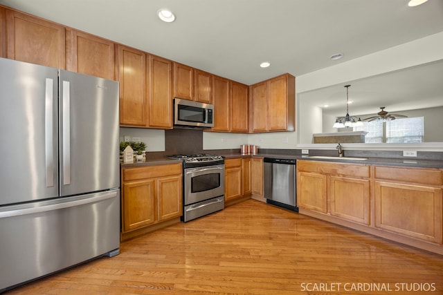 1045 Crane Pt, Elgin, IL 60124 - kitchen featuring a sink, light wood-type flooring, dark countertops, recessed lighting, and stainless steel appliances