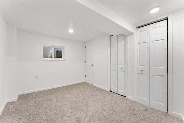 below grade area with carpet flooring, baseboards, and recessed lighting