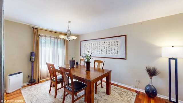 2008 Chang Ct, Naperville, IL 60540 - dining space featuring a notable chandelier, baseboards, and light wood finished floors