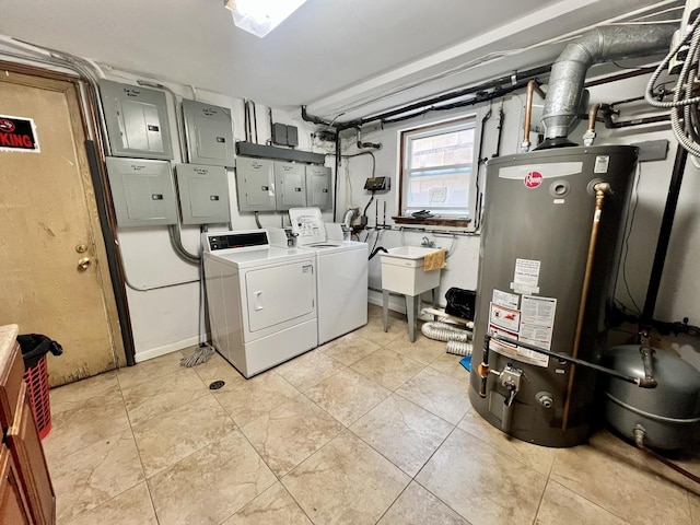 laundry area with gas water heater, separate washer and dryer, and electric panel