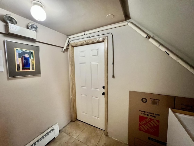 entrance foyer with baseboard heating and light tile patterned floors