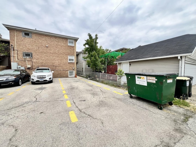 uncovered parking lot with fence