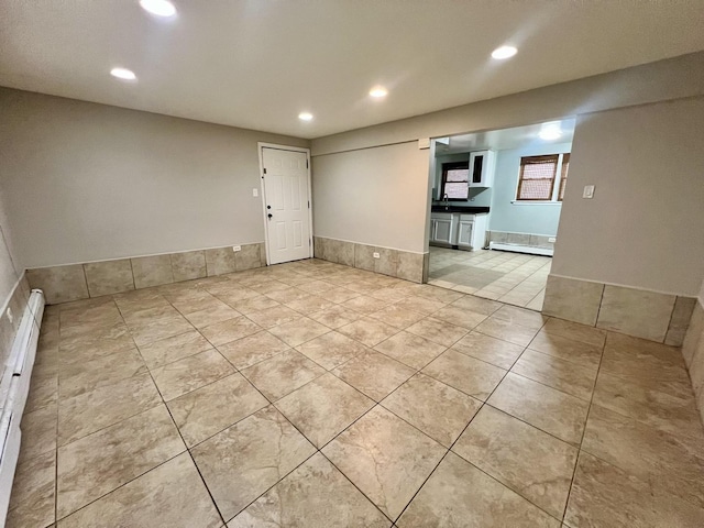 empty room with light tile patterned floors and recessed lighting