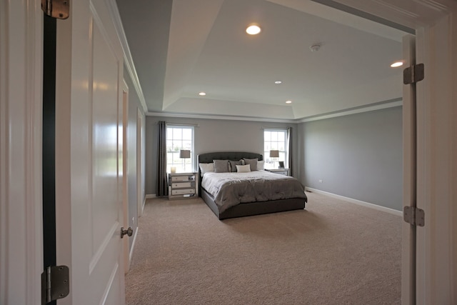 carpeted bedroom with recessed lighting, baseboards, ornamental molding, and a raised ceiling