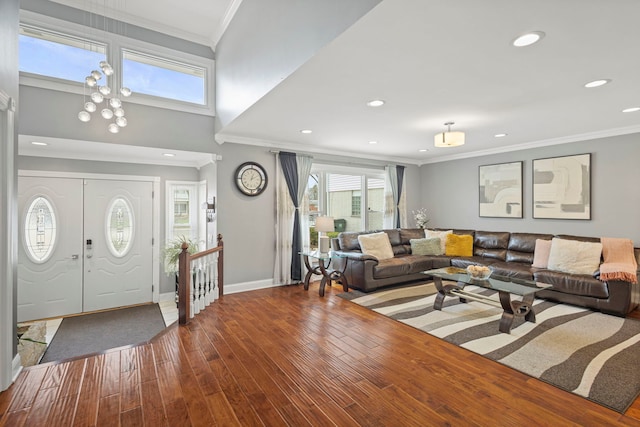 foyer entrance featuring recessed lighting, a high ceiling, dark wood-style floors, crown molding, and baseboards