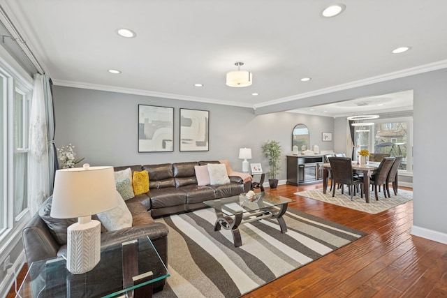 living area with baseboards, wood finished floors, and recessed lighting