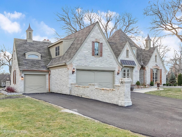 29W221 Oak Knoll Rd, West Chicago, IL 60185 - french country home with driveway, a garage, stone siding, and a front yard
