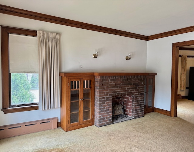 unfurnished living room featuring crown molding, a baseboard heating unit, carpet flooring, baseboards, and a fireplace