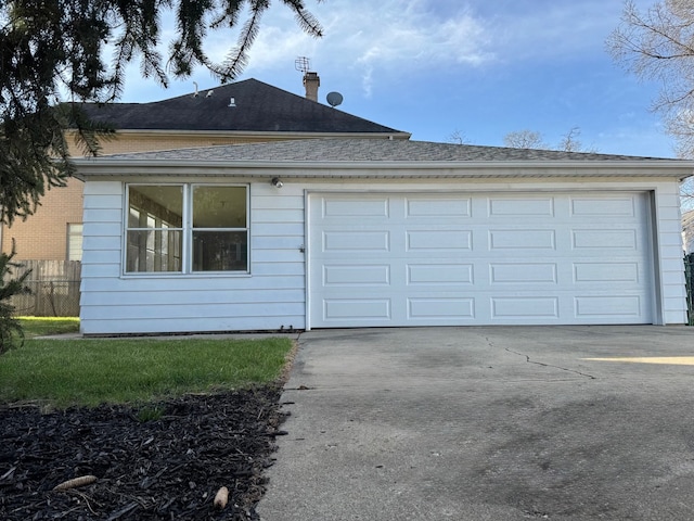 view of property exterior with driveway, a shingled roof, fence, and an attached garage
