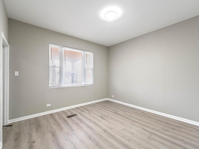 30 Washington Ave, La Grange, IL 60525 - unfurnished room featuring visible vents, light wood-style flooring, and baseboards