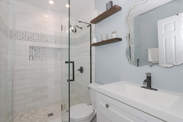 1423 Deer Creek Ln, Lake In The Hills, IL 60156 - bathroom with a shower stall, toilet, vanity, and recessed lighting