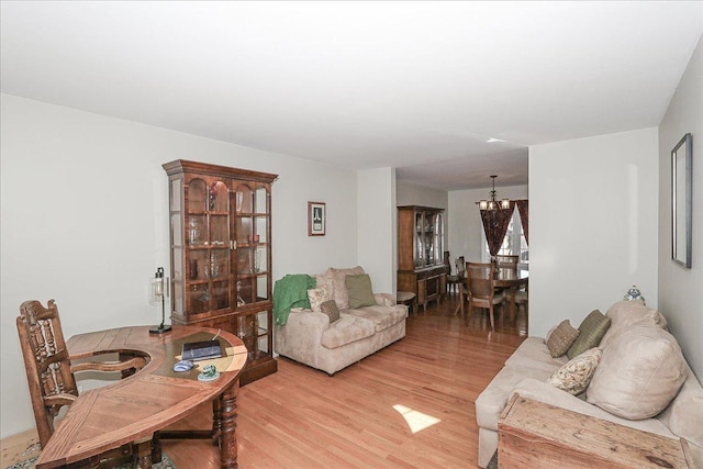 1423 Deer Creek Ln, Lake In The Hills, IL 60156 - living room with a chandelier and light wood-style floors