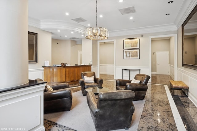 living room with ornamental molding, recessed lighting, a chandelier, inlaid floor details, and a decorative wall