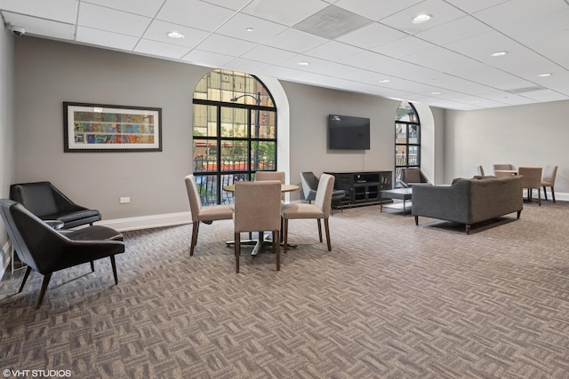 dining room with dark carpet, baseboards, recessed lighting, and a drop ceiling