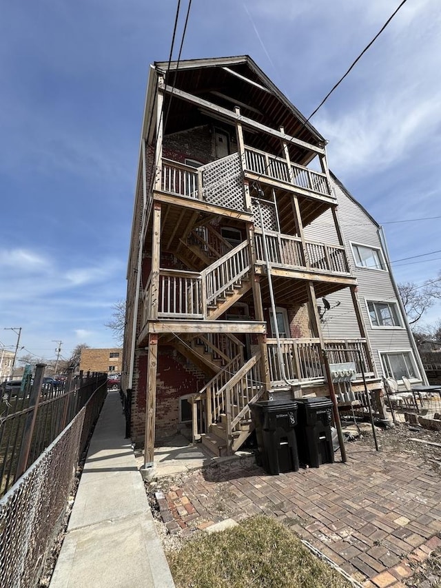 5120 S Throop St, Chicago, IL 60609 - rear view of house featuring a patio, fence, and stairway