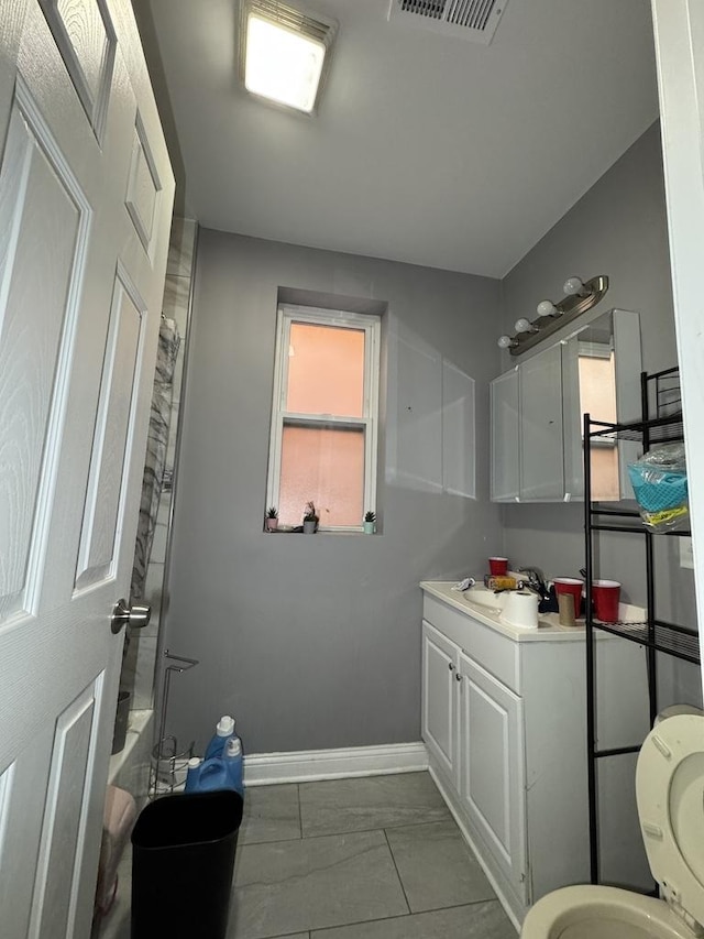 5120 S Throop St, Chicago, IL 60609 - full bath with baseboards, visible vents, toilet, and vanity