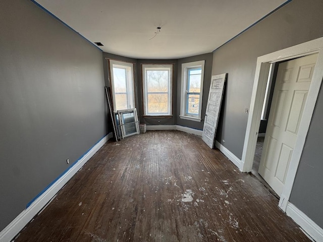 5120 S Throop St, Chicago, IL 60609 - unfurnished bedroom featuring baseboards, visible vents, and hardwood / wood-style flooring