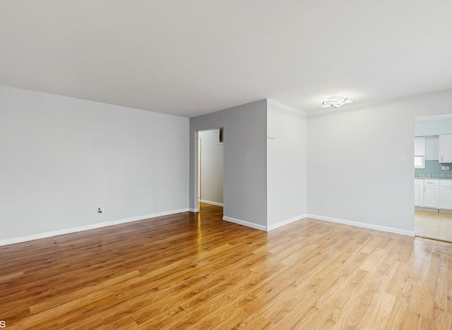 1317 Mackinaw Ave, Calumet City, IL 60409 - spare room with baseboards and light wood finished floors