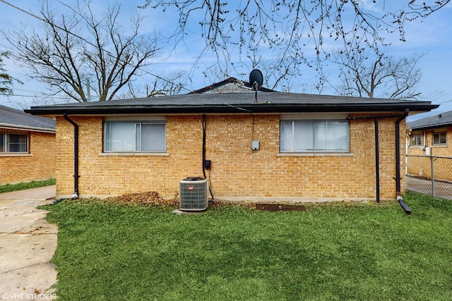 1317 Mackinaw Ave, Calumet City, IL 60409 - view of front of home with fence, a front lawn, and brick siding