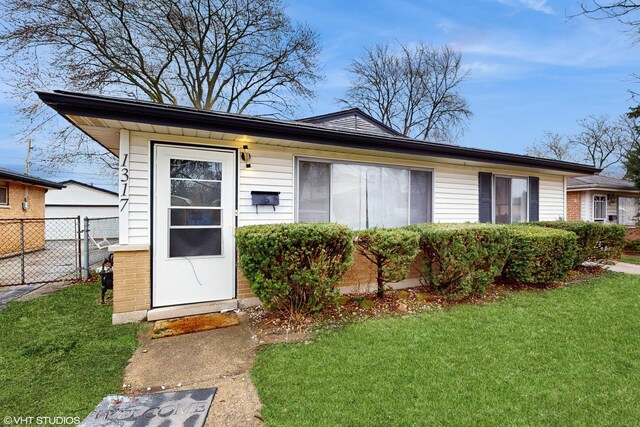 1317 Mackinaw Ave, Calumet City, IL 60409 - view of front of home featuring brick siding and a front yard