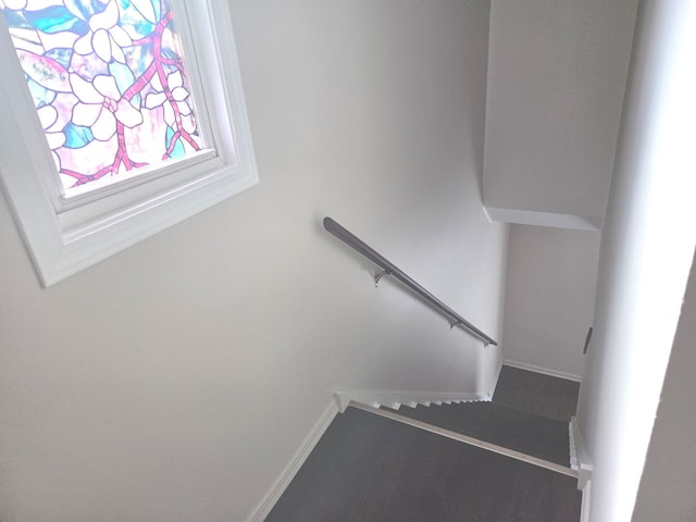 stairs featuring baseboards