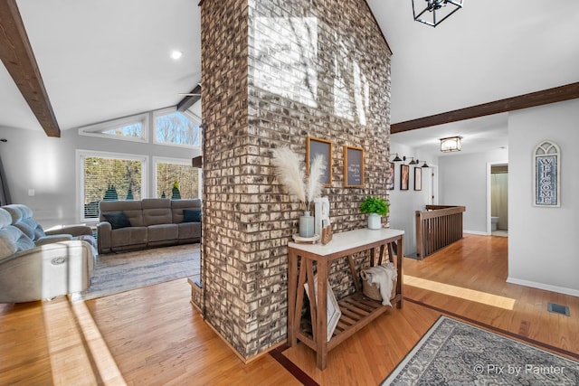 3134 Chellington Dr, Johnsburg, IL 60051 - hall featuring visible vents, high vaulted ceiling, wood finished floors, and beam ceiling