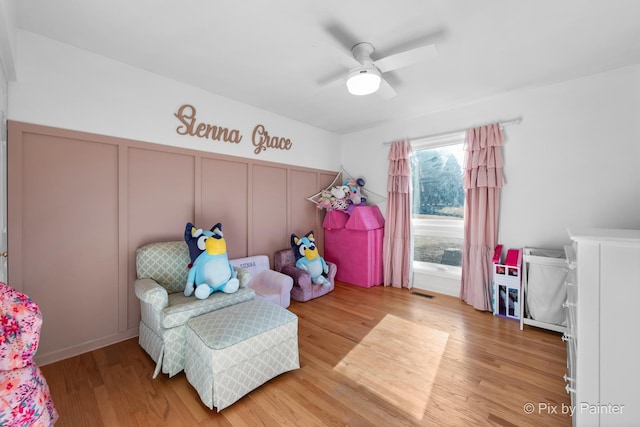3134 Chellington Dr, Johnsburg, IL 60051 - bedroom with visible vents, a decorative wall, wood finished floors, and a ceiling fan