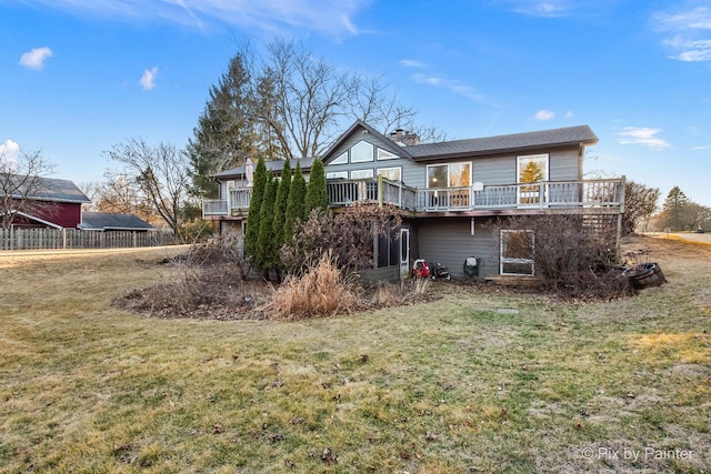 3134 Chellington Dr, Johnsburg, IL 60051 - rear view of house featuring a chimney, a yard, and a wooden deck