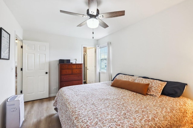 bedroom with ceiling fan and wood finished floors
