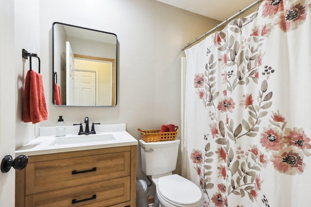 bathroom with vanity, toilet, and a shower with shower curtain