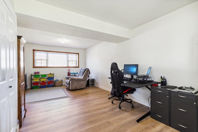 office featuring light wood-style floors and baseboards