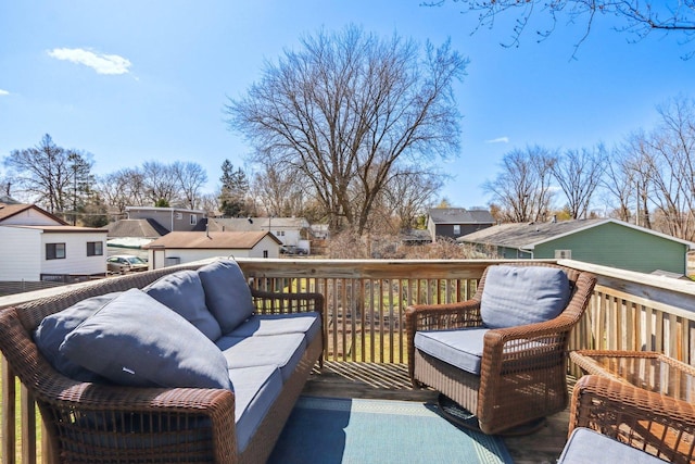 wooden deck with outdoor lounge area and a residential view