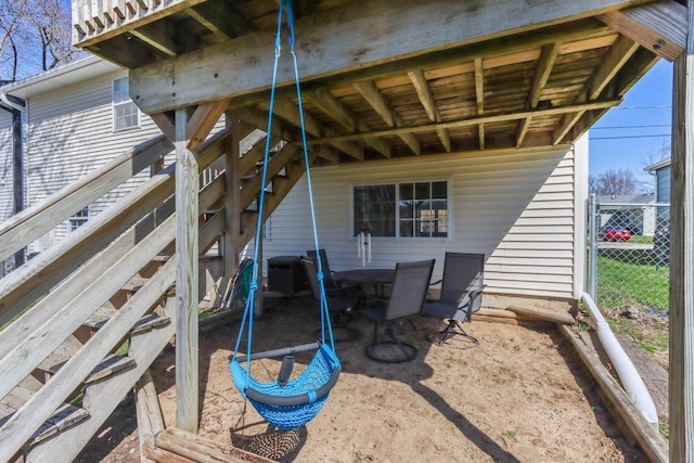 view of patio featuring fence