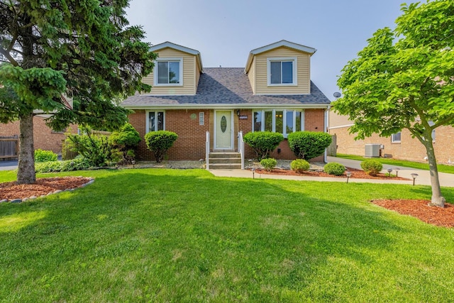 7733 Suburban Ln, Bridgeview, IL 60455 - view of front of house with brick siding, a front lawn, and roof with shingles