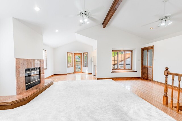 7733 Suburban Ln, Bridgeview, IL 60455 - unfurnished living room with a high end fireplace, light wood finished floors, healthy amount of natural light, and recessed lighting