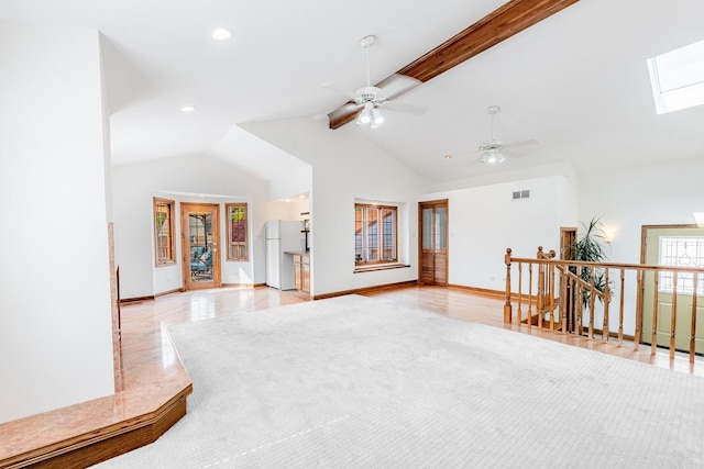 7733 Suburban Ln, Bridgeview, IL 60455 - living area with a skylight, a ceiling fan, recessed lighting, high vaulted ceiling, and beamed ceiling