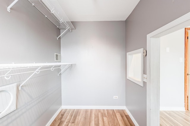 7733 Suburban Ln, Bridgeview, IL 60455 - spacious closet featuring light wood-style flooring