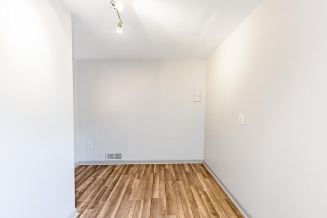 7733 Suburban Ln, Bridgeview, IL 60455 - unfurnished bedroom with light wood-style floors and baseboards
