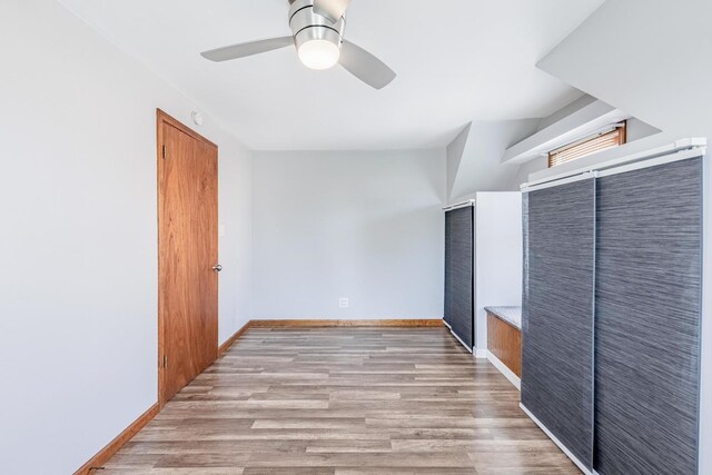 7733 Suburban Ln, Bridgeview, IL 60455 - spare room with ceiling fan and light wood-style floors