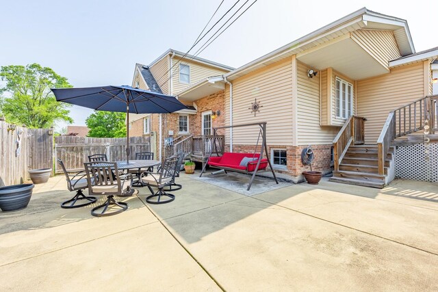 7733 Suburban Ln, Bridgeview, IL 60455 - view of patio with an outbuilding, a detached garage, and outdoor dining space